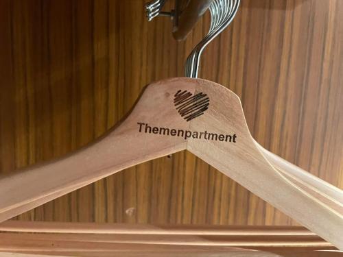 a piece of wood with a heart sign on it at Themenpartment Himmel und Mehr Penthouse in Gelsenkirchen