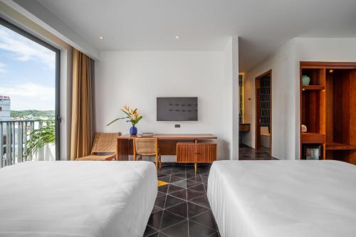 Katil atau katil-katil dalam bilik di Le Mint Hotel Quy Nhơn