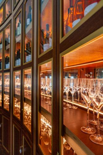 a bunch of wine glasses in a bar at Montargil Monte Novo in Montargil