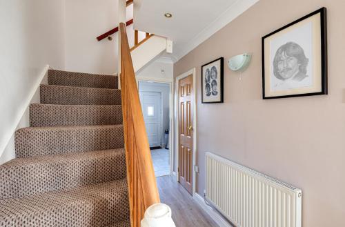 a staircase in a home with a stair case at George Harrison's Former 3Bed Home in Liverpool in Speke