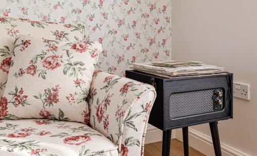 a living room with a couch and a tv at George Harrison's Former 3Bed Home in Liverpool in Speke