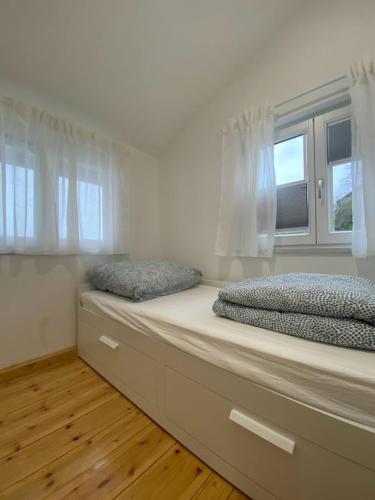 Ένα ή περισσότερα κρεβάτια σε δωμάτιο στο Wick Home Apartment 2 Lahr-Burgheim