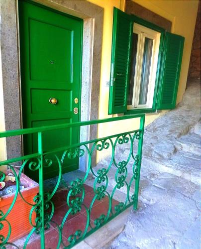 a green door and window on a building at Giardino sul Lago SPA Jacuzzi in Castel Gandolfo