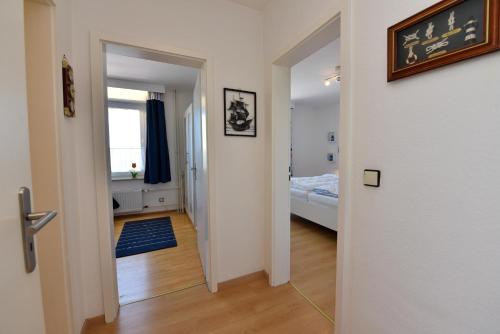 Postel nebo postele na pokoji v ubytování Haus "Strandnixe" Appartement ST107