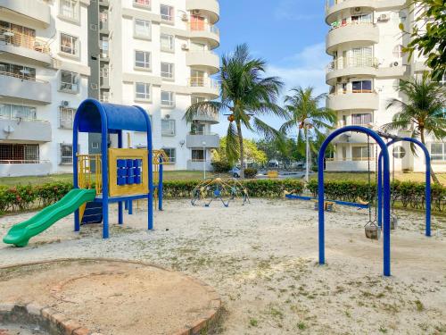 a playground in front of a apartment building at BayView Suites Port Dickson By MAISON in Port Dickson