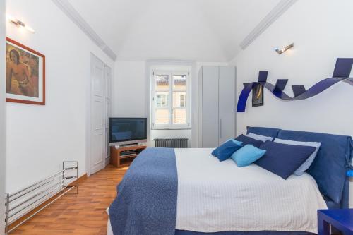 A bed or beds in a room at San Salvario Family Apartment by Wonderful Italy