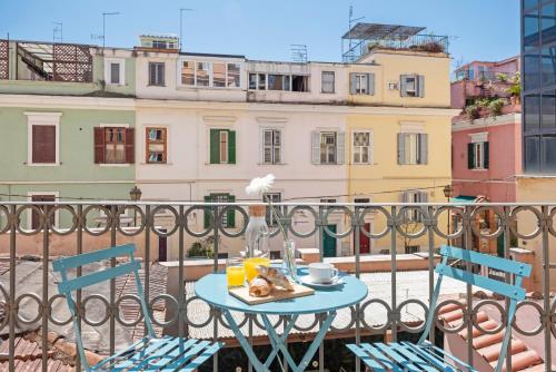 a table with a plate of food on a balcony at Hotel Parker - Gruppo BLAM HOTELS in Rome