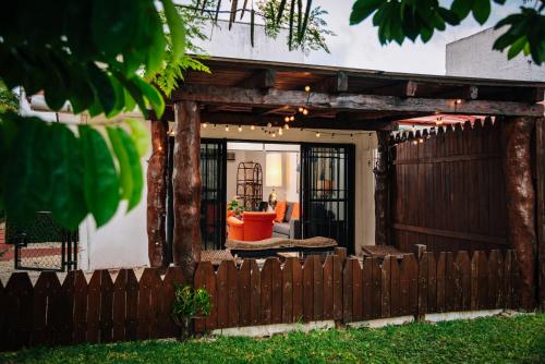 a wooden fence in front of a house at Newly renovated ! Villa Laguna Cancun in Cancún