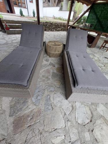 two beds sitting on top of a stone patio at ATRIUM Holiday home in Bihać