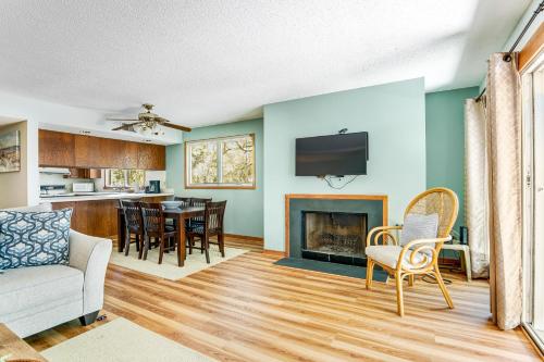 a living room with a couch and a fireplace at Seagrove 5-A in Isle of Palms