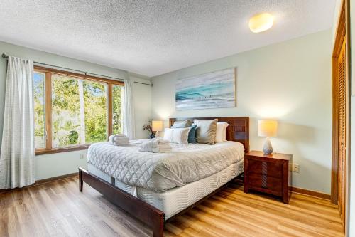 a bedroom with a large bed and a window at Seagrove 5-A in Isle of Palms