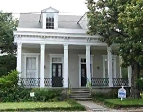 an image of a white house with columns at Historic Viavant Cottage - Jazz Fest/FairGrounds in New Orleans