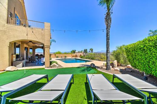 a villa with a pool and a palm tree at Pool, Spa and Putting Green Fountain Hills Home! in Fountain Hills