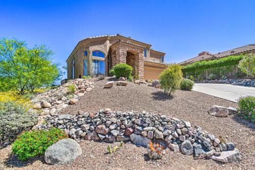 a house with a rock garden in front of it at Pool, Spa and Putting Green Fountain Hills Home! in Fountain Hills
