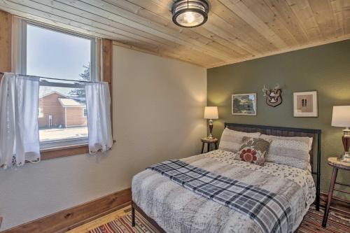 una camera da letto con un letto e una grande finestra di Renovated Historic Church Along Namekagon River! a Seeley