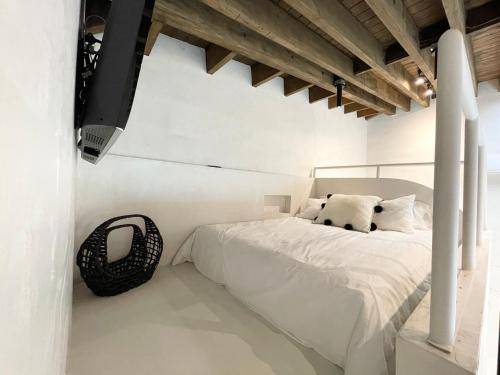 Uma cama ou camas num quarto em Atelier Lumi at Lumicollection