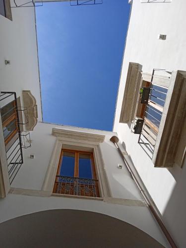 a view from the inside of a building with a window at Palazzo Donna Chicchi in Galatone