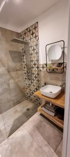 a bathroom with a sink and a shower at Palazzo Donna Chicchi in Galatone