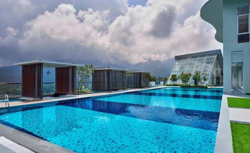 a large swimming pool in front of a building at Genting Windmill Amazing Sky Pool 2bedroom With Aircon Wi-Fi in Genting Highlands