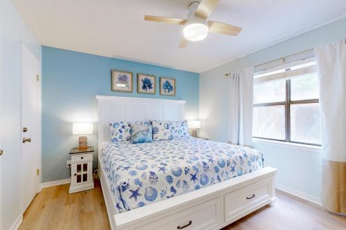 a bedroom with a bed and a ceiling fan at Lani Kai 130 in Gulf Shores