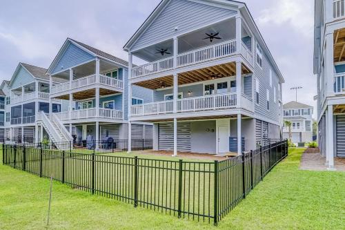 a large house with a fence in front of it at Hammock Breeze 21 in Hilton Head Island