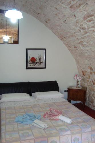 Postel nebo postele na pokoji v ubytování Masseria SD di Manchisi