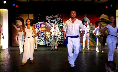 a group of people walking on a stage at Sunshine Corfu Hotel And Spa in Nisakion