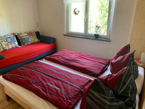 Katil atau katil-katil dalam bilik di Ferienhaus Fröhlich