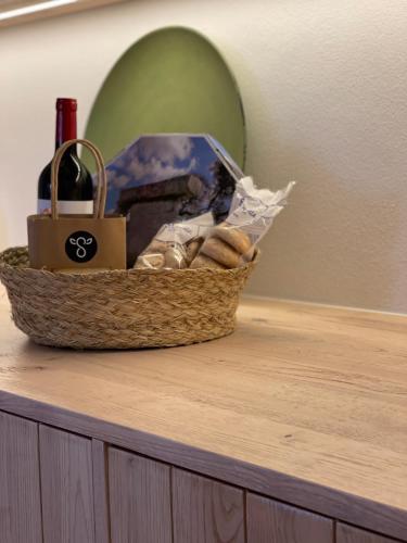 a basket of bread sitting on top of a table at Agroturismo Bini Aumaia in Es Mercadal
