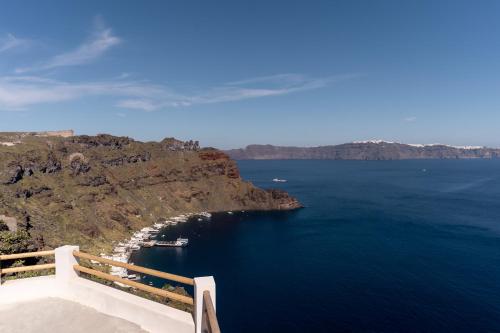 a view of a large body of water on a cliff at Evanthia Best View Thirassia Island Hotel in Thirasia