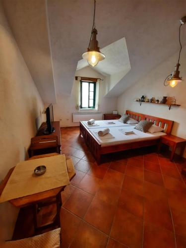 a bedroom with a large bed and a table at Apartments Jelena Skver in Herceg-Novi