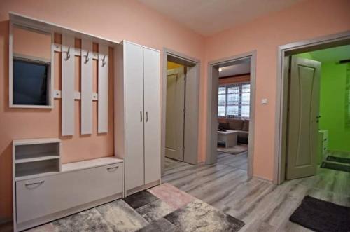 a room with a dressing room with a tv at Апартамент Фреш in Velingrad