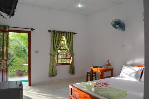 Ένα ή περισσότερα κρεβάτια σε δωμάτιο στο Diem Lien Guesthouse