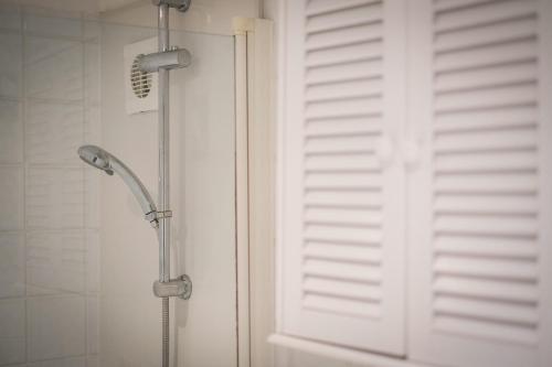 a shower with a glass door in a bathroom at Glen Wynne Windermere - FREE off-site Health Club access with Pool, Sauna, Steam Room & Gym Short 5 Minute Drive Away in Windermere