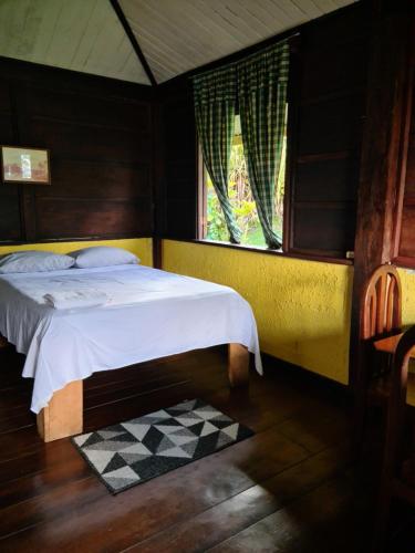 Ένα ή περισσότερα κρεβάτια σε δωμάτιο στο Los Gallitos Eco Lodge