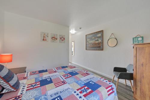 a bedroom with a bed with a quilt on it at Brownsville Motel in Brownsville