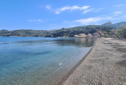 
a beach with a view of the ocean at Hotel Mare in Portoferraio

