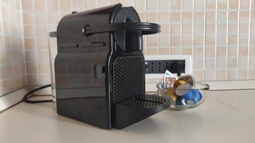 a black coffee maker sitting on a counter at I love Rapallo La casa AlMar in Rapallo