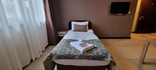 מיטה או מיטות בחדר ב-City Inn Family Apart
