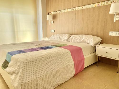 A bed or beds in a room at Modern Apartment in Salou - 50 m² + Pool