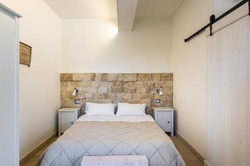 Postel nebo postele na pokoji v ubytování Masseria Bio - Agriturismo Villa Grazia