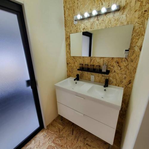 a bathroom with a white sink and a mirror at Agri Museum NADA - Vacation STAY 40517v in Minamiawaji
