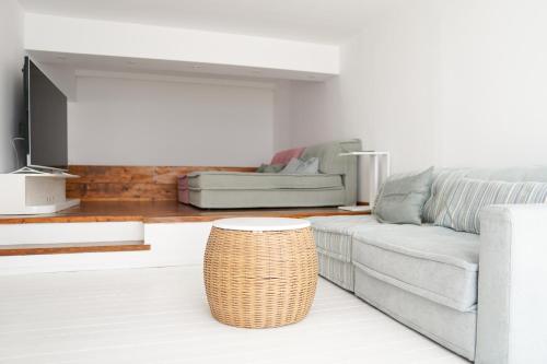 a living room with a couch and a table at Boathouse in Kardamaina