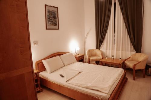 Ένα ή περισσότερα κρεβάτια σε δωμάτιο στο Escape Pensiune