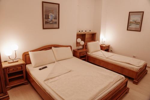 Ένα ή περισσότερα κρεβάτια σε δωμάτιο στο Escape Pensiune