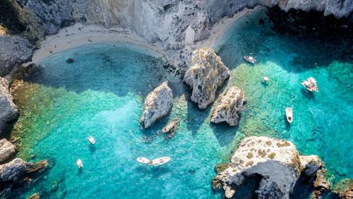 an aerial view of a beach with rocks and water at Cà Sal Holiday Home in Lesina