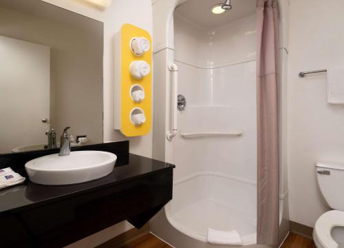 a bathroom with a sink and a shower and a toilet at Motel 6-Pismo Beach, CA in Pismo Beach