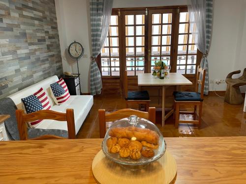 a bowl of donuts on a table in a living room at candelaria vacaciones centro, playa 20 metros, in center holidays beach at 20 meters in Candelaria