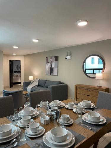 a dining room with a table with dishes on it at HIDALGO 119 - TERRAZA Y SUITES in Zacatecas