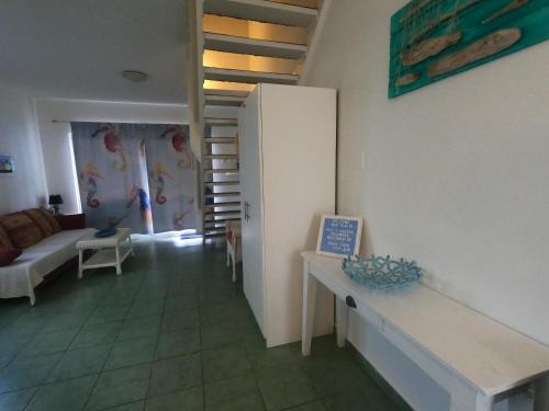 a living room with a couch and a table at Breathtaking View - Playa Lagun - Curacao in Lagun